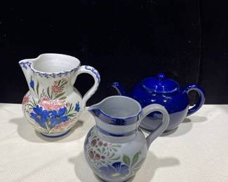 Three pitchers one is a stoneware