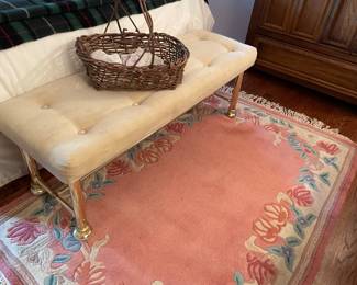 brass-legged bench; wool area rug