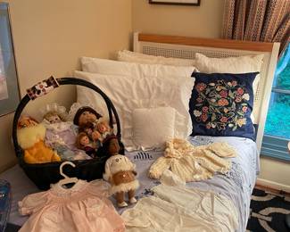 Twin cane headboard, twin mattress; dolls (vintage cabbage patch, Madame Alexander, and more); vintage baby clothes/christening dress
