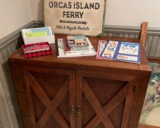 Wood storage cabinet and vintage signs
