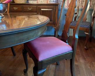 Side view of the chairs (armchair in the back with sideboard)