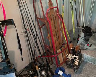 Fishing poles, vintage skates and sled 