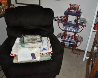 La-Z-Boy electric recliner w/remote, collection of red/white/blue tablecloths, placemats, and napkins, antique and vintage quilts.