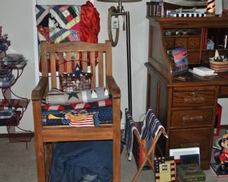 Collection of red/white/blue tablecloths, placemats, and napkins, oversized Ikea teak? rocking chair, antique and vintage quilts, floor lamp, oak rolltop desk, collection of lighthouse items, ship decor, oak two-drawer file cabinet,  lots of red/white/blue decor.