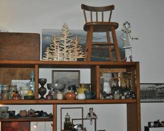 Large oak open shelving unit, antique wooden crate, decorative wooden trees, child's tall stool, MCM decor, collection of studio pottery, wooden animal articulated figures.