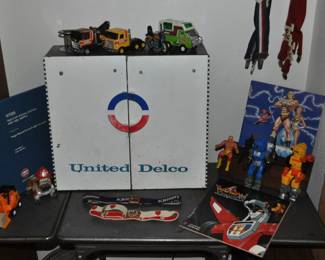 United Delco cabinet, metal Lexco office typewriter table dropleaf w/wheels, toy figures, toy cars and trucks.