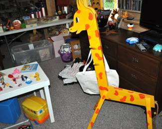 Vintage giraffe clothes stand, more toys, dresser, DVDs and CDs.