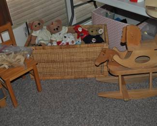 This room is enormous!  This half is filled with children's books, games and puzzles, office supplies, tole painting supplies, Ikea storage containers, craft supplies, dressers, tall multi-drawer cabinet, printer, craft kits, boxes, frames, antique children's desks, red/white/blue decorations, bee collectibles, pails, rocking horses, children's furniture, dining chairs, stuffed animals, baskets, and sooo much more!