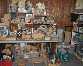 This room is enormous!  This half is filled with children's books, games and puzzles, office supplies, tole painting supplies, Ikea storage containers, craft supplies, dressers, tall multi-drawer cabinet, printer, craft kits, boxes, frames, antique children's desks, red/white/blue decorations, bee collectibles, pails, rocking horses, children's furniture, dining chairs, stuffed animals, baskets, and sooo much more!