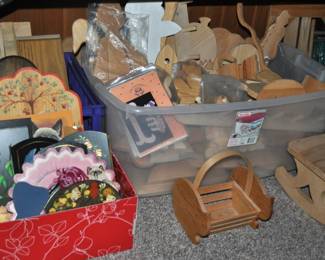 This room is enormous!  This half is filled with children's books, games and puzzles, office supplies, tole painting supplies, Ikea storage containers, craft supplies, dressers, tall multi-drawer cabinet, printer, craft kits, boxes, frames, antique children's desks, red/white/blue decorations, bee collectibles, pails, rocking horses, children's furniture, dining chairs, stuffed animals, baskets, and sooo much more!