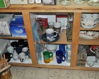 Kitchen items including boxed small appliances, boxed crystal, coffee mugs, plasticware, pottery, candleholders, studio pottery w/star design, studio pottery w/heart design.
