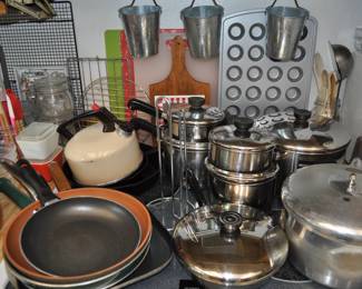 Kitchen:  Corningware, Laguna Melmac dishes, linens, Pyrex nesting bowls, mint green 1968 hand mixer w/instruction booklet, barware, coffee makers, Corelle dinnerware, flatware, kitchen gadgets, Krups grinder, Oster blender, popcorn popper, pots and pans, Pyrex baking dishes, toaster, waffle iron, cobalt glass dinner set, Gense Ultima stainless steel, Oneida crystal, Orrefors crystal, Princess House, set of Snowman china, Sweden stainless steel serving pieces, cookbooks, huge selection of coffee mugs (many collectible and many in original boxes) including Starbucks, Laurel Burch, Deborah Mumm, tea kettles, knife set, milk glass, magnets, Rubbermaid, Ikea jars, rolling pins, baking items, paper goods, spices and seasonings, large griddle, canned goods, glassware, and more!