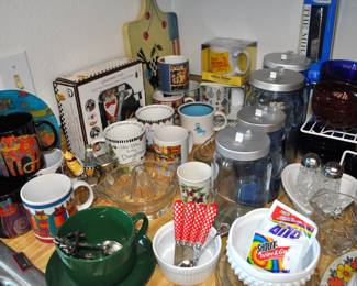 Kitchen:  Corningware, Laguna Melmac dishes, linens, Pyrex nesting bowls, mint green 1968 hand mixer w/instruction booklet, barware, coffee makers, Corelle dinnerware, flatware, kitchen gadgets, Krups grinder, Oster blender, popcorn popper, pots and pans, Pyrex baking dishes, toaster, waffle iron, cobalt glass dinner set, Gense Ultima stainless steel, Oneida crystal, Orrefors crystal, Princess House, set of Snowman china, Sweden stainless steel serving pieces, cookbooks, huge selection of coffee mugs (many collectible and many in original boxes) including Starbucks, Laurel Burch, Deborah Mumm, tea kettles, knife set, milk glass, magnets, Rubbermaid, Ikea jars, rolling pins, baking items, paper goods, spices and seasonings, large griddle, canned goods, glassware, and more!