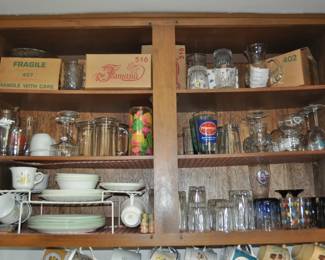 Kitchen:  Corningware, Laguna Melmac dishes, linens, Pyrex nesting bowls, mint green 1968 hand mixer w/instruction booklet, barware, coffee makers, Corelle dinnerware, flatware, kitchen gadgets, Krups grinder, Oster blender, popcorn popper, pots and pans, Pyrex baking dishes, toaster, waffle iron, cobalt glass dinner set, Gense Ultima stainless steel, Oneida crystal, Orrefors crystal, Princess House, set of Snowman china, Sweden stainless steel serving pieces, cookbooks, huge selection of coffee mugs (many collectible and many in original boxes) including Starbucks, Laurel Burch, Deborah Mumm, tea kettles, knife set, milk glass, magnets, Rubbermaid, Ikea jars, rolling pins, baking items, paper goods, spices and seasonings, large griddle, canned goods, glassware, and more!