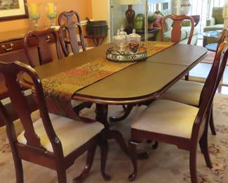 Stunning dining table/6 chairs, extra leaves and pads.