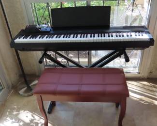 Yamaha keyboard with sbench, music books, stand and more.