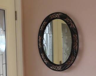 Decorative oval hall mirror.