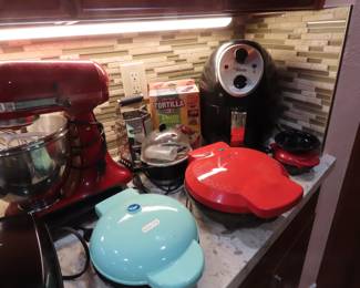 Multiple donut, waffle, egg grills and air fryer.