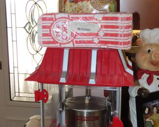 Like new party time popcorn machine, with kernels and popcorn bags.
