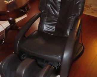 Black leather like Human Touch massage chair that is in perfect working order.