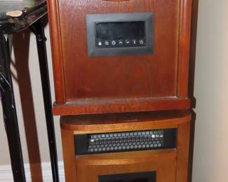 Two infrared electric heaters with remotes.