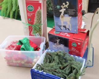 Prelit Christmas tree and deer set. Boxes of garlands and decorations.