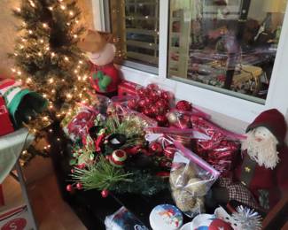 Prelit tree and Christmas decorations.