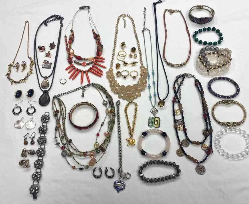 Assortment Of Costume Jewelry Clip On Earrings, Bracelets, Earrings, Necklaces, One Sterling Bracelet, And One 12KT. Gold Filled Necklace And Clip On Earrings