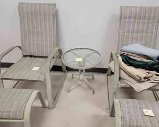 Vintage Patio Chairs With Round Small Table And Two Foot Stools And Some Outdoor Furniture Covers