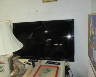 one of TWO huge  like new television sets-- on by Samsung