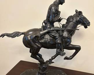 A different reproduction of Remington’s “Cowboy”
