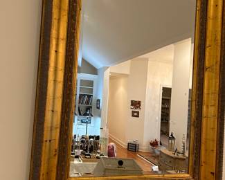 Large gold framed beveled mirror 