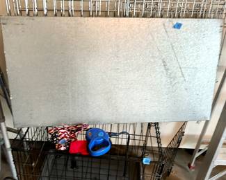 Small black dog cage $25
Silver large dog cage $35