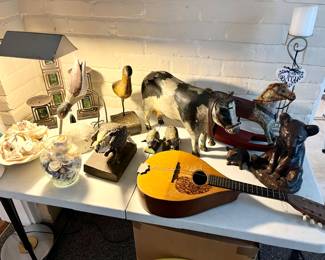 Bid items; Folk Art & Mandolin 
Gould Anderson folk art animals.
Mandolin made by Martin Co.  Early 1900’s