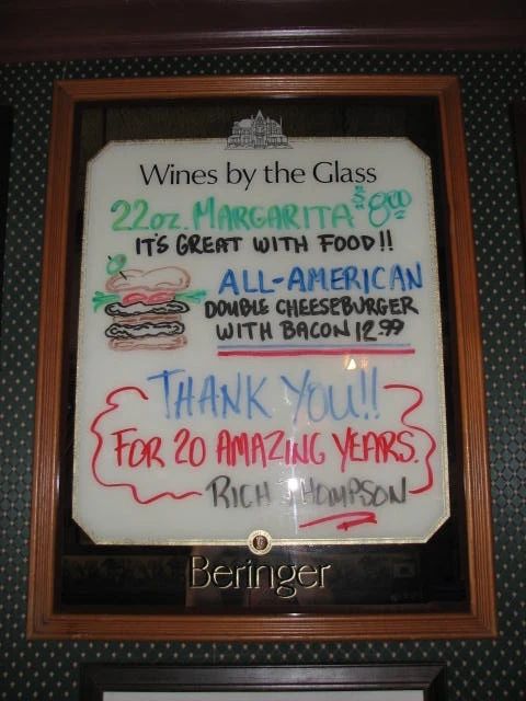 One of the specials signs which is also a Beringer Wine Mirror with a menu board.