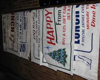 Several advertising vinyl banners from the Lamplight