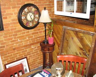 a clock, lamp and a small stand