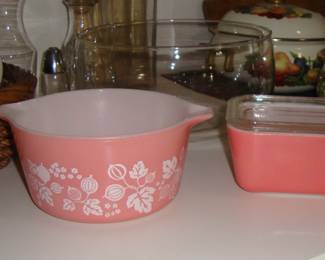 (LEFT) VINTAGE PYREX GOOSEBERRY CASSEROLE DISH. (RIGHT) VINTAGE FLAMINGO PINK PYREX REFRIGERATOR DISH WITH LID