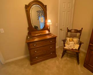 Cool dresser with mirror and antique rocking chair with leather seat