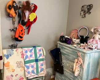 Antique quilts and a great shabby chic dresser.  Vintage suitcase and more. 