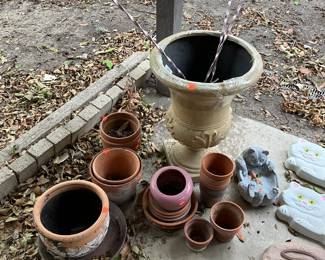 Flower pots and vintage aluminum yard candleholders