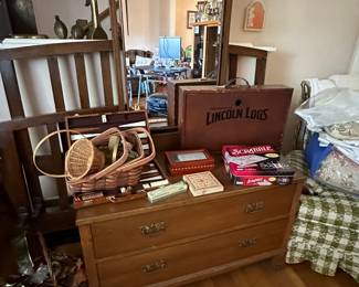 Antique dresser with mirror. Full size bed behind it, does not match 