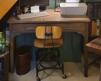 Vintage wood desk and architect-style desk chair. 