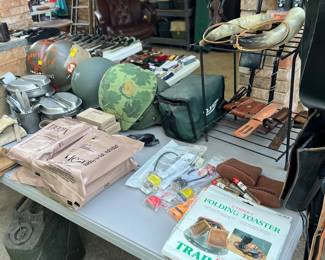 Tons of militaria… helmets, bayonets, MRE’s, camping gear, canteens, etc.
