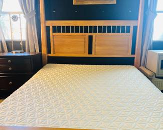 This is a pretty maple wood 4 poster bed with super clean mattress!