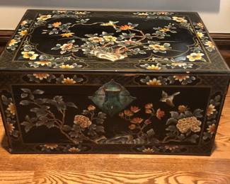 A vintage Chinoiserie painted chest with traditional decoration.