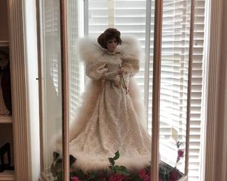Impressive collection of Franklin Heirloom hand-painted porcelain dolls including this beautiful figure housed in a custom-made glass display case.