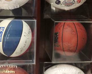 Houston Rockets basketballs with Clyde Drexler and Hakeem Olajuwon autographs.