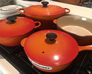 Le Creuset enameled cast iron cookware in mint condition.