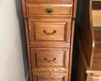 Lots of traditional oak veneered and mahogany finish office furniture and file cabinets.